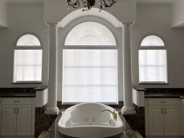Plantation shutters and custom shades installed in a Plantation, FL home