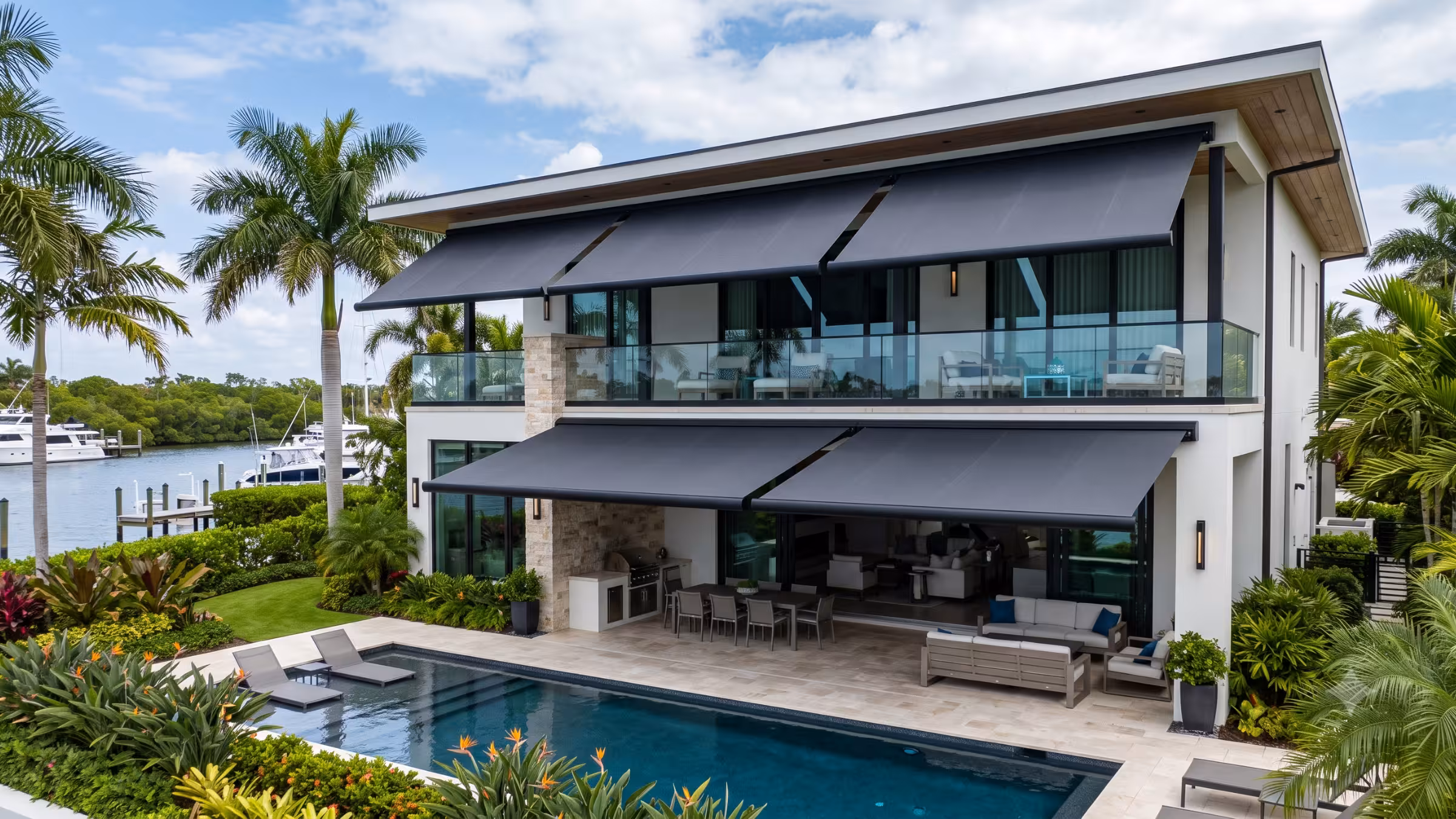 Retractable motorized awning shading a patio in a South Florida home