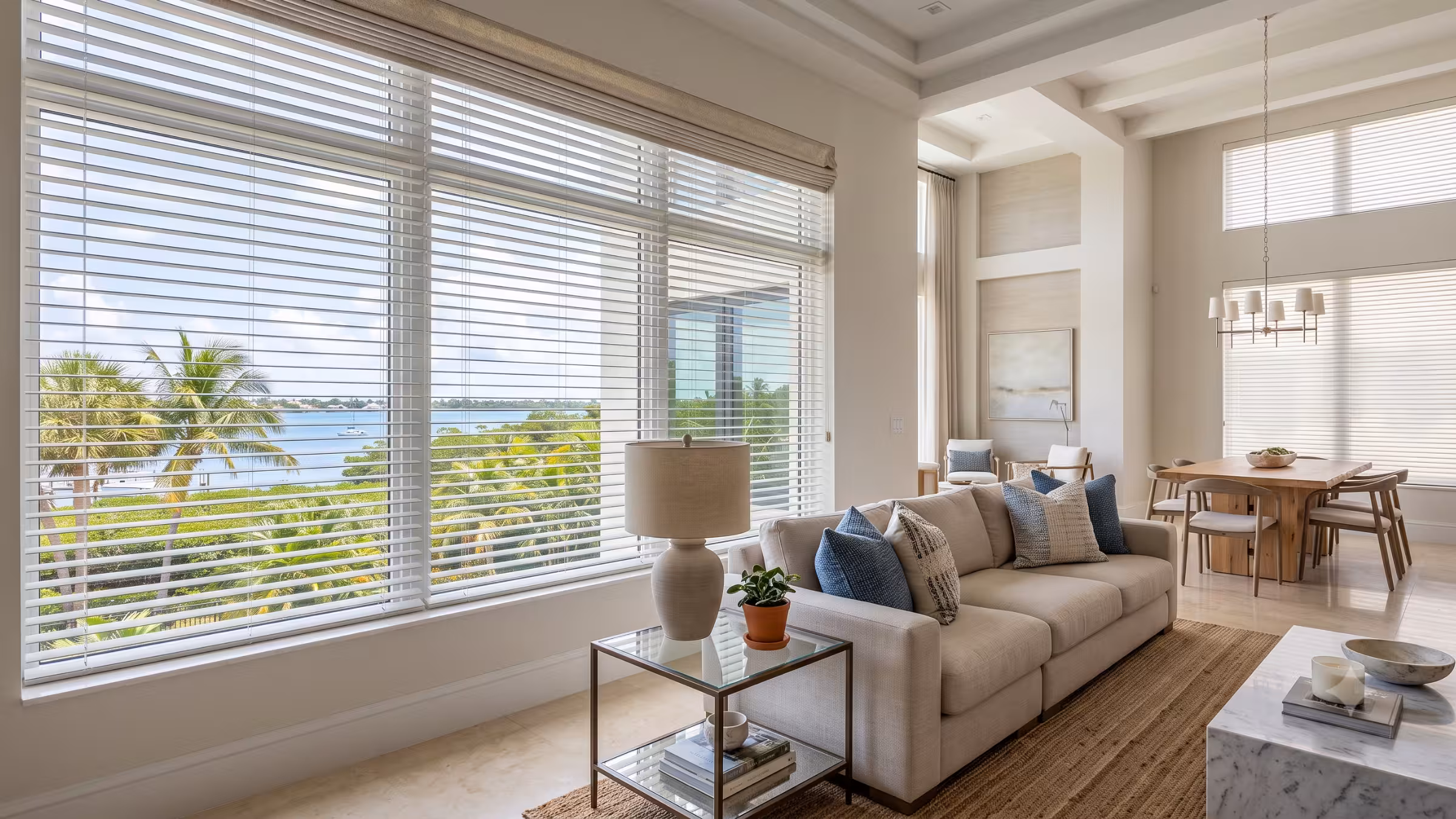 Custom faux wood window blinds in a light-filled South Florida living room