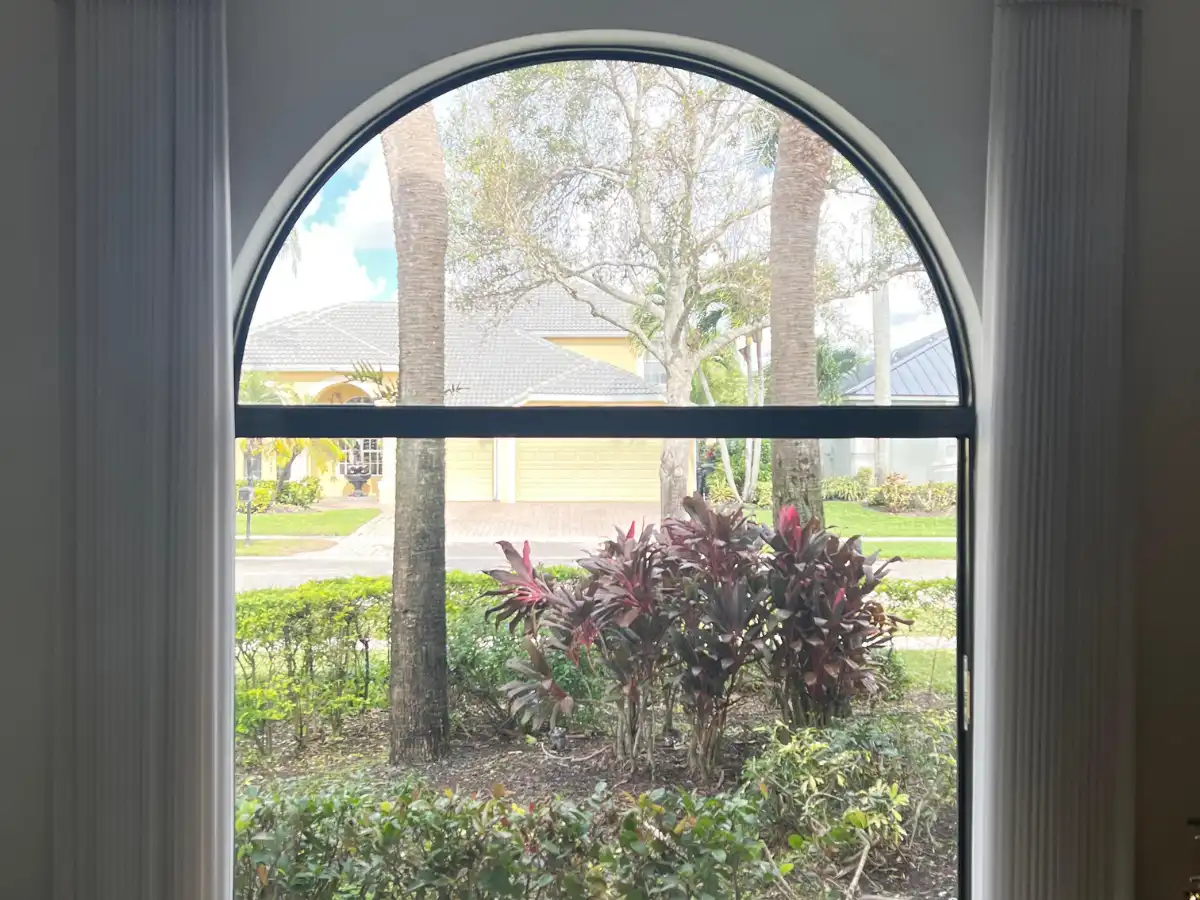 Custom drapes with sheers layered in a Coral Springs formal room