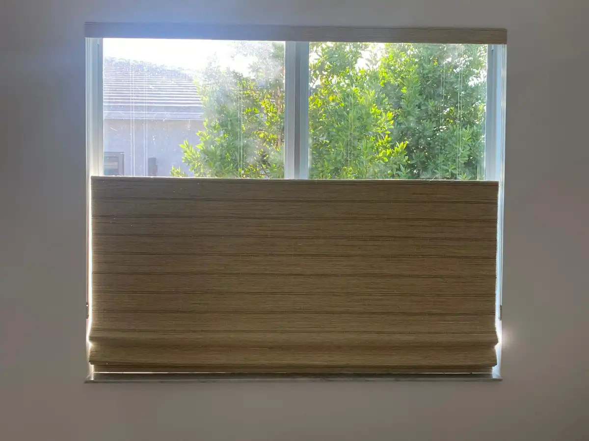 Elegant Roman shades in a South Florida bedroom