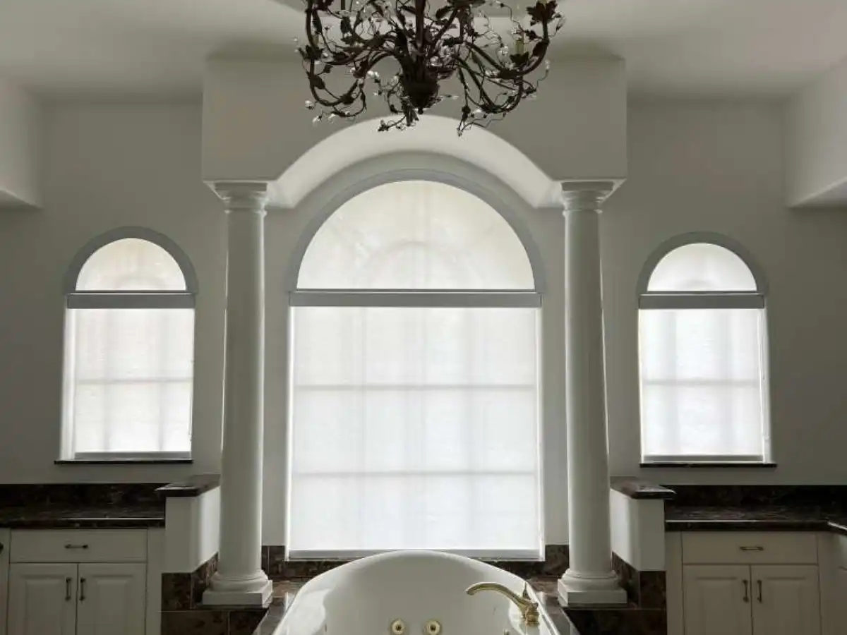 Motorized smart shades controlled by phone app in a Florida home